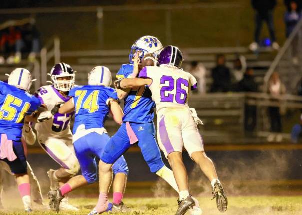 Roland Chambers, #26, sacks the Wizards’ quarterback late in the fourth quarter.