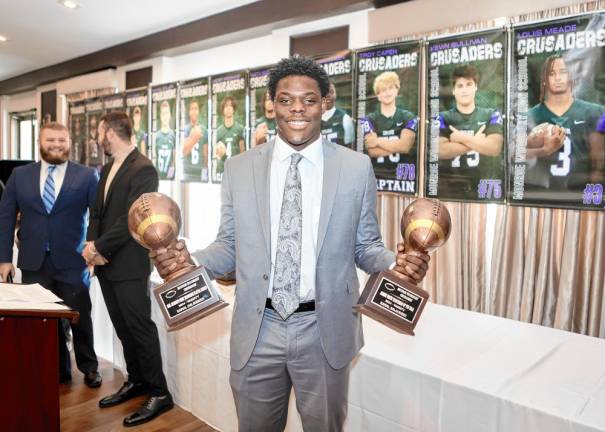 Kamal Salaudeen with his Trenchmen and Best Defensive Player awards.