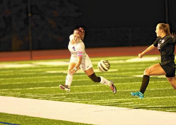 Crusader defender Lila King clears the ball out of the defensive end.