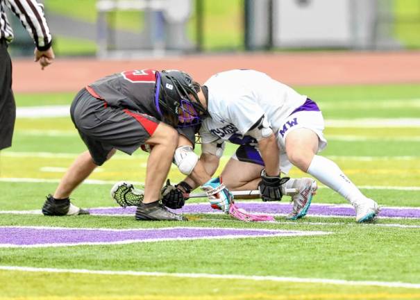 Senior Dominck Cosenza performs another solid faceoff for the season.