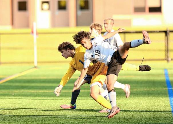 Evan Espinal, #18, scored on this diving header in the first half.