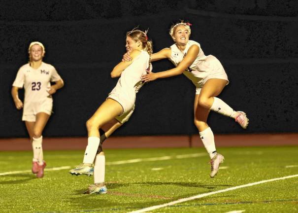 Grace Gillette and Madison Magazino celebrate Grace’s second goal.