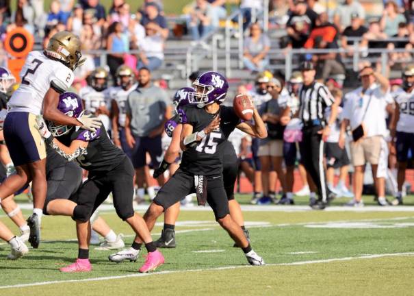 Crusader quarterback David Fennessy looks for a receiver in the fourth quarter.