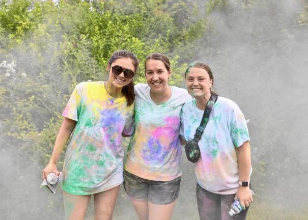 Teachers Taylor Sullivan, Jadin Kilner, and Jordan Earl catch their breath after the race.