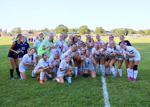 The Crusaders celebrate their 3-2 opening day game win.