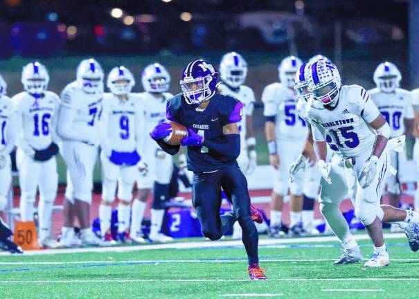 Defensive back Jaden Medrano, #4, heads for the end zone with his pick six in the third quarter.