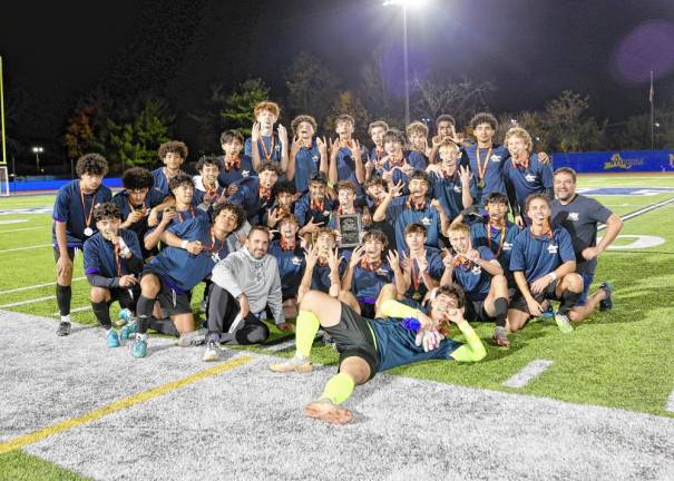 The Crusaders and their coaches celebrate their Section 9 Championship.