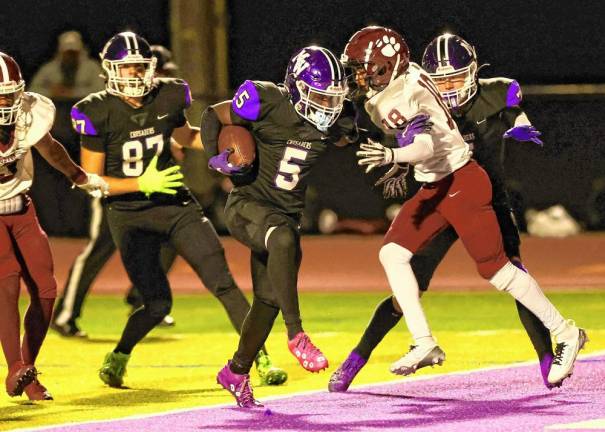 Nate Coulanges, #5, scores on a eight-yard touchdown run in the fourth quarter.