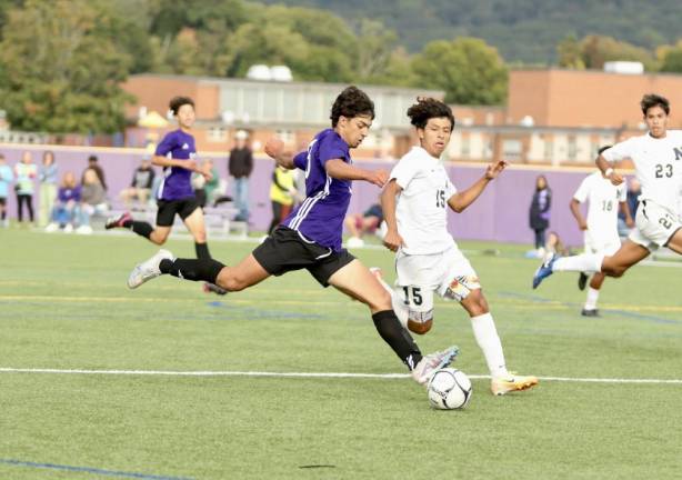 Nicholas Almeida gets off a shot in the first quarter.