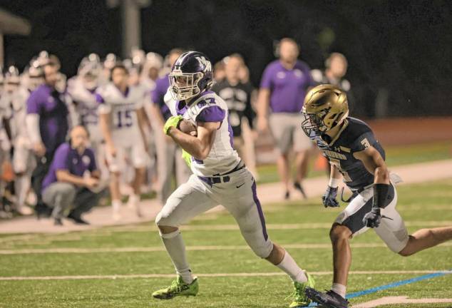 Crusader tight-end Charlie Theokas scores on a 6-yard pass in the third quarter.