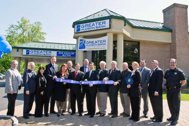 Greater Hudson Bank launched its new branch at 360 Route 17M in Monroe with a ribbon-cutting ceremony on May 18 that was attended by community leaders, dignitaries and bank officials. Pictured from left to right are: Village of Harriman Trustee Edward Shuart Jr., Walter Popailo (Orange County Relationship Manager, Greater Hudson Bank), Gina Herska (Branch Operations Manager, Greater Hudson Bank), Eric J. Wiggins (President &amp; CEO, Greater Hudson Bank), Assemblywoman Annie Rabbitt, Monroe Mayor Jim Purcell, Orange County Executive Ed Diana, Dan Rifkin (Board member of Greater Hudson Bank), Ray Pantel (Board member of Greater Hudson Bank), Kenneth Torsoe (Chairman of Greater Hudson Bank), Steven Baskt (Board member of Greater Hudson Bank), Village of Monroe Trustee Charles Pakula, Stephanie Sweeton, a district representative for U.S. Rep. Nan Hayworth representative), Basel Rabie (SVP, branch administrator of Greater Hudson Bank), Alexander Jamieson (Orange County commercial lender of Greater Hudson Bank), and Orange County Undersheriff Ken Jones.