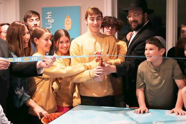 Teens from across Orange County get ready to cut the ribbon, opening the new CTeen Lounge At Chabad of Orange County in Monroe. Photos by CTeen member Hailey Leonard, a senior at Washingtonville High School.