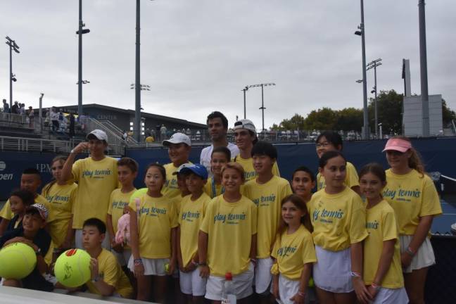 Matchpoint kids get some time with four-time Grand Slam winner Jean-Julien Rojer.