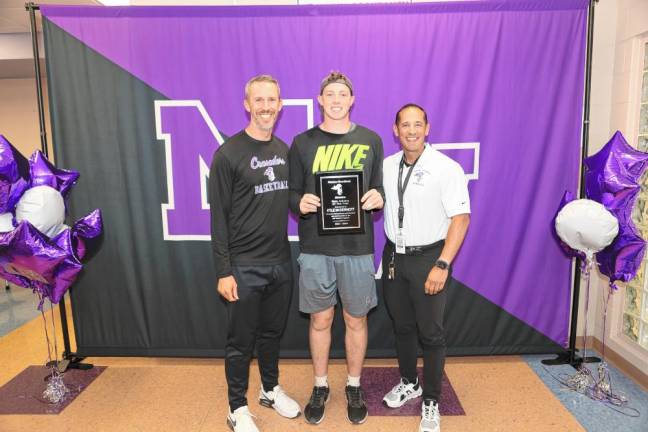 Kyle McDermott (center) receives his Male Athlete of the Year award from coaches James Hahn and Christopher Vero.