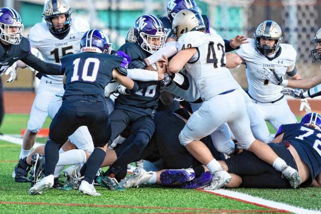 Ethan Maldonado, #16, pushes his way into the Hawks’ end zone.