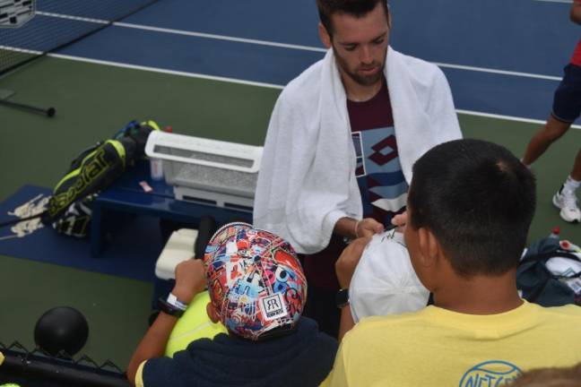 Matchpoint players getting autographs from Austin Krajicek, ranked 22 in the world.