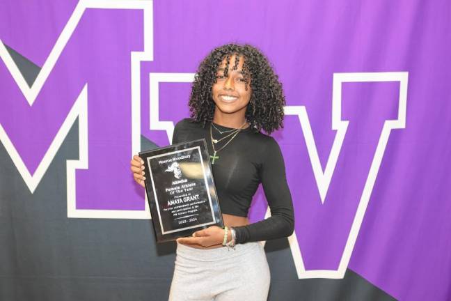 Amaya Grant shows her Female Athlete of the Year Award.