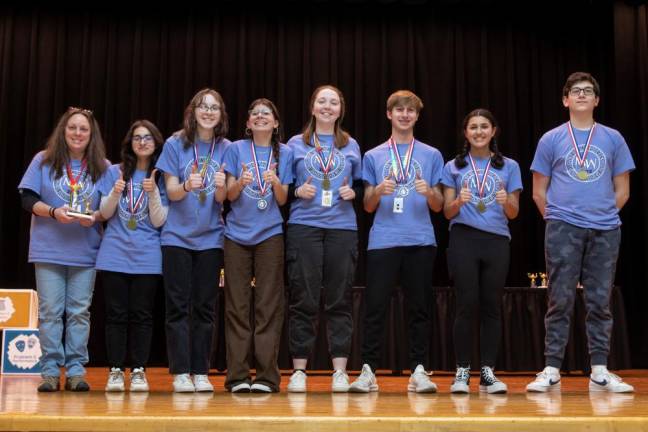 (L-R) Coach Johnson, Bisma Malik, Sophie Baer, Nicole Ottavio, Amara Leitner, Connor Williamson, Lauren Mueller and Dylan Escobar won first place for Pirates and the Treasure.