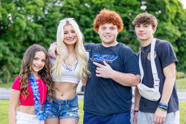 Gigi, Summer, Jared and Marco of Monroe walking around the ponds before the Monroe Fireworks 2024. Photo by Sammie Finch