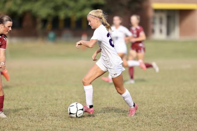 Kyra Gilligan, #23, attacks the Tiger defense.