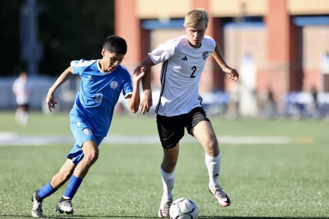 Dylan Nematz battles with a Middle defender for the ball.