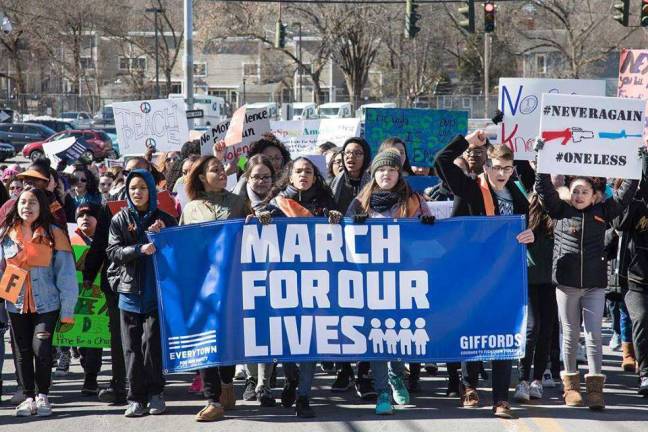 Photo by Robert G. Breese The March for Our Lives demonstration attracted about 700 people to the event in Middletown last Saturday.