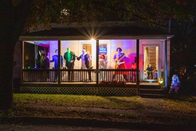 <b>The “Bates Motel’ on Howe St. in Warwick, NY has a porch lineup of classic Halloween movie villains including Mike Myers, Art the Clown, Leatherface, Chucky, Billy the Puppet, and more. (Photo by Aja Brandt)</b>