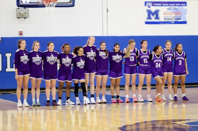 The Crusaders line up for the National Anthem.