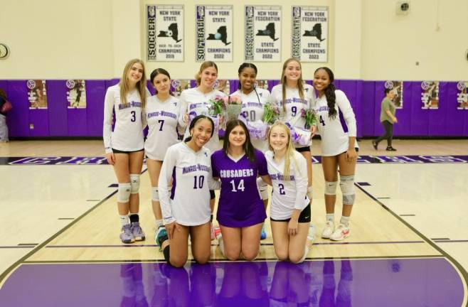 L-R back row: Crusaders volleyball seniors Janis Miola, Emily Rojas, Gabriella Schaefer, Ayanna Wilson, Emily O’Brien, and Miah Fortune. L-R front row: Seniors Aryanna Brown, Abby Ohren, and Amanda Barry.