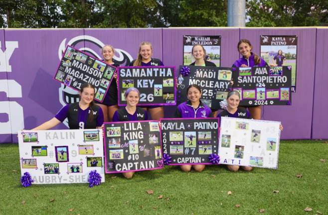 Crusader seniors with their posters after the game.