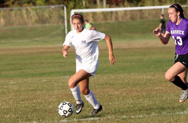 The strong play of Christina Palanza (#5) has been a key to the Crusaders' success.