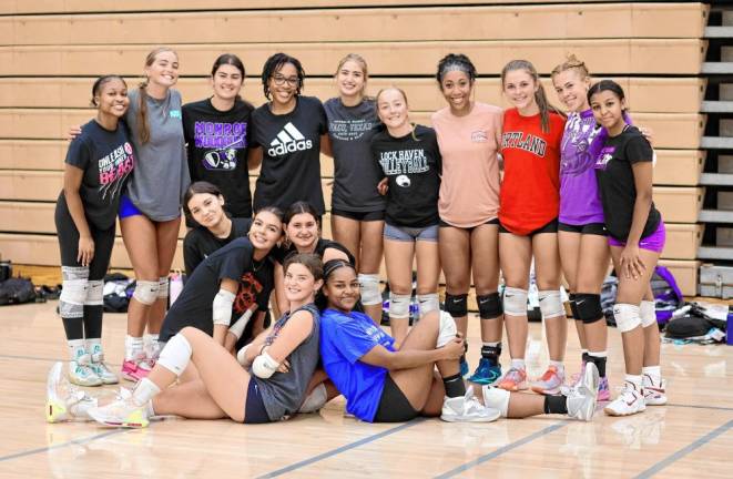 The 2024 Crusader varsity volleyball team takes a break during practice.