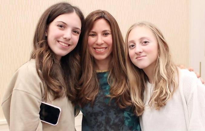 Dani Gold of Central Valley and Brooke Reese of Monroe celebrate with Chana Burston, director of Chabad of Orange County, at the ribbon-cutting of the new CTeen Lounge At Chabad of Orange County.