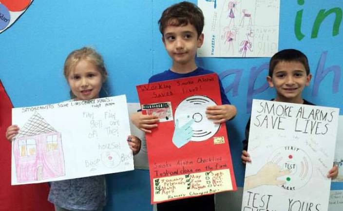 Fire Safety Poster contest winners from Sapphire Elementary: First graders Anna Llewelyn, Liam McMahon and Anthony Leone.