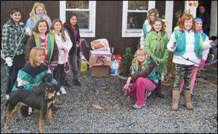 Monroe Girl Scouts brings cheer and supplies to animal sanctuary
