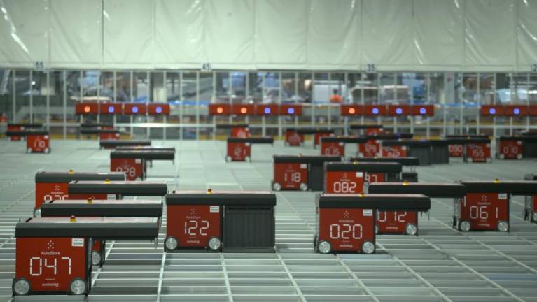 The robots shuffling bins at the Medline facility.