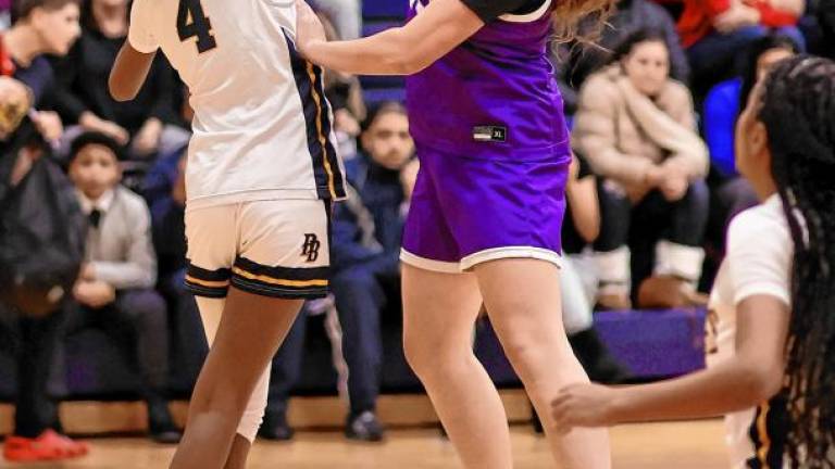 Leah Sheeran, #25, shoots over a Pine Bush defender.