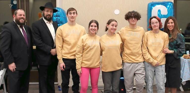 CTeen Leaders led the ceremony for the grand opening and Ribbon Cutting of the new CTeen Lounge at Chabad of Orange County. Pictured from left to right are Rabbi Pesach Burston, director, Chabad of Orange County, Rabbi Shimon Rivkin, Director of CTeen International Network, Ariel Koyfman of Chester, Haley Olstein of Monroe, Lola Sale of Highland Mills, Amir Mosker of Monroe, Ava Maier of Monroe and Chana Burston, director of Chabad of Orange County. Photos by CTeen member Hailey Leonard, Senior, Washingtonville.