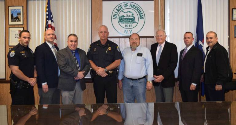 Photo provided by the Harriman Police Department Standing from left to right are: Police Officer Mike Biagini, Police Officer Edward Josefovitz (accreditation manager), Sgt. Adam Basilicata, Chief Daniel Henderson, Mayor Stephen Welle and the three accreditation assessors assigned by New York State Commission on Police Accreditation: Daniel Hickey, Michael Dilbone and Michael Spedaliere.